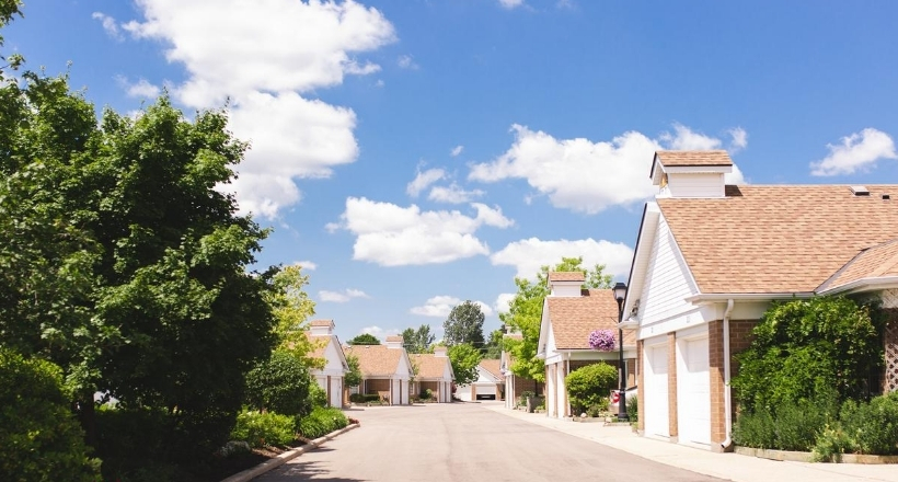 photo of a blue sky featuring a row of our town homes