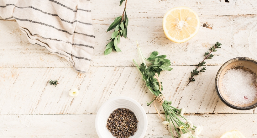 lemon and bath salt on white wooden table