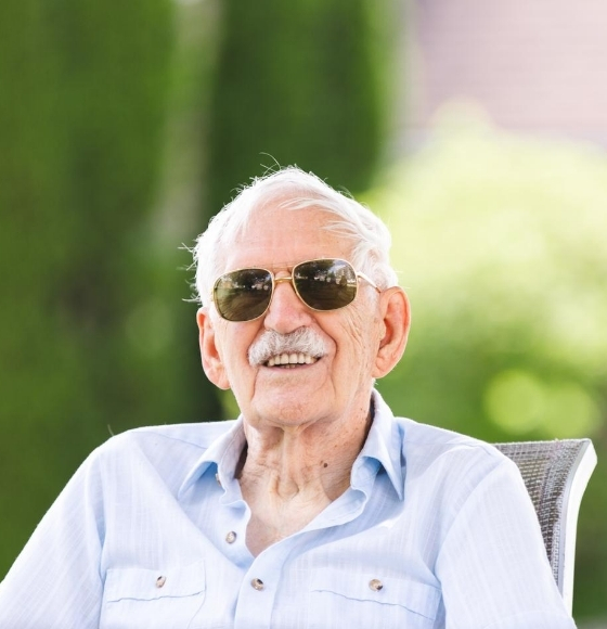man smiling with sunglasses on