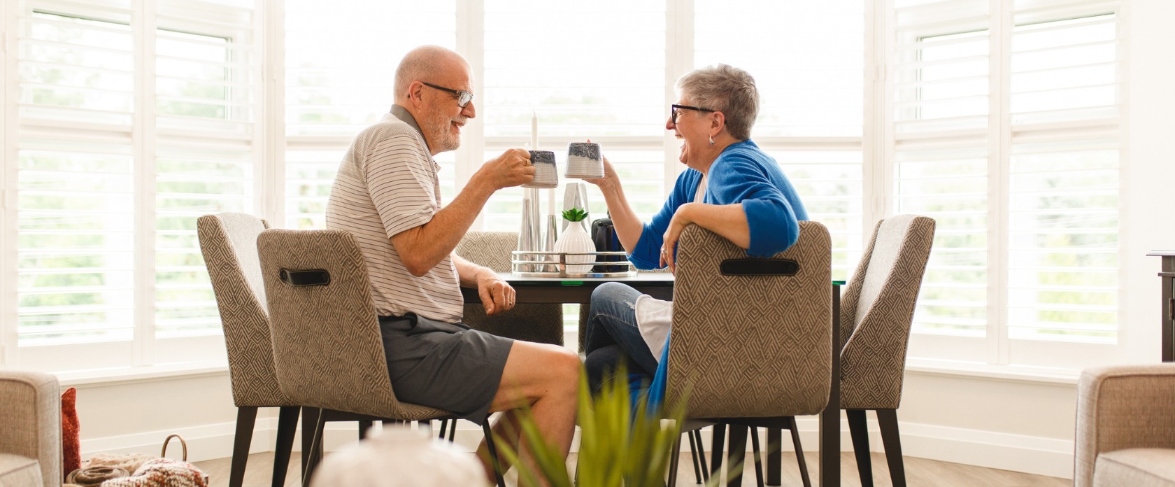 Two residents enjoying coffee in their Life Lease Unit