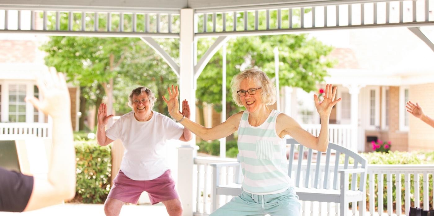 yoga two women laughing