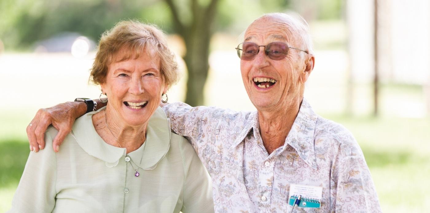 couple laughing with each other 