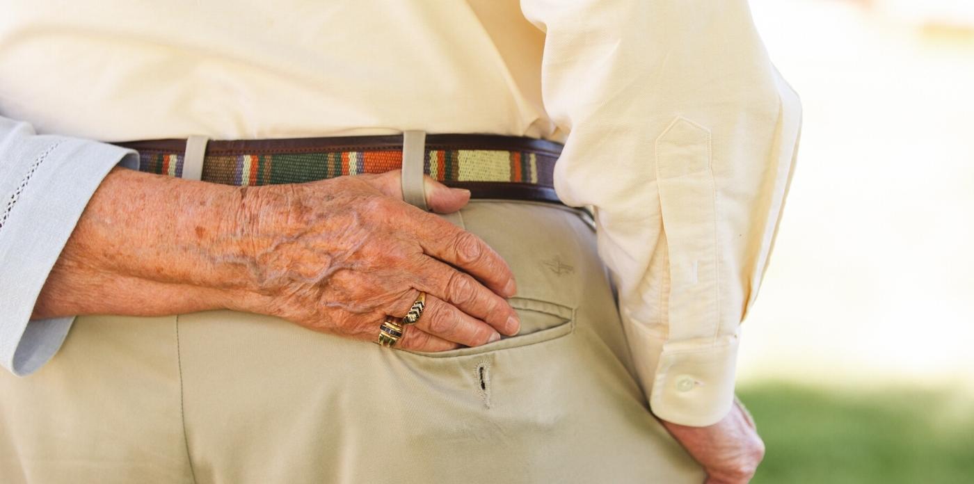 women with hand in her husband's pocket
